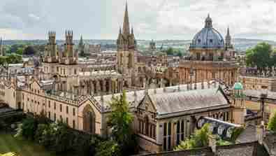 An aerial shot of Oxford city centre, capturing the Radcliffe Camera and 'Oxford Spires' at the centre. 