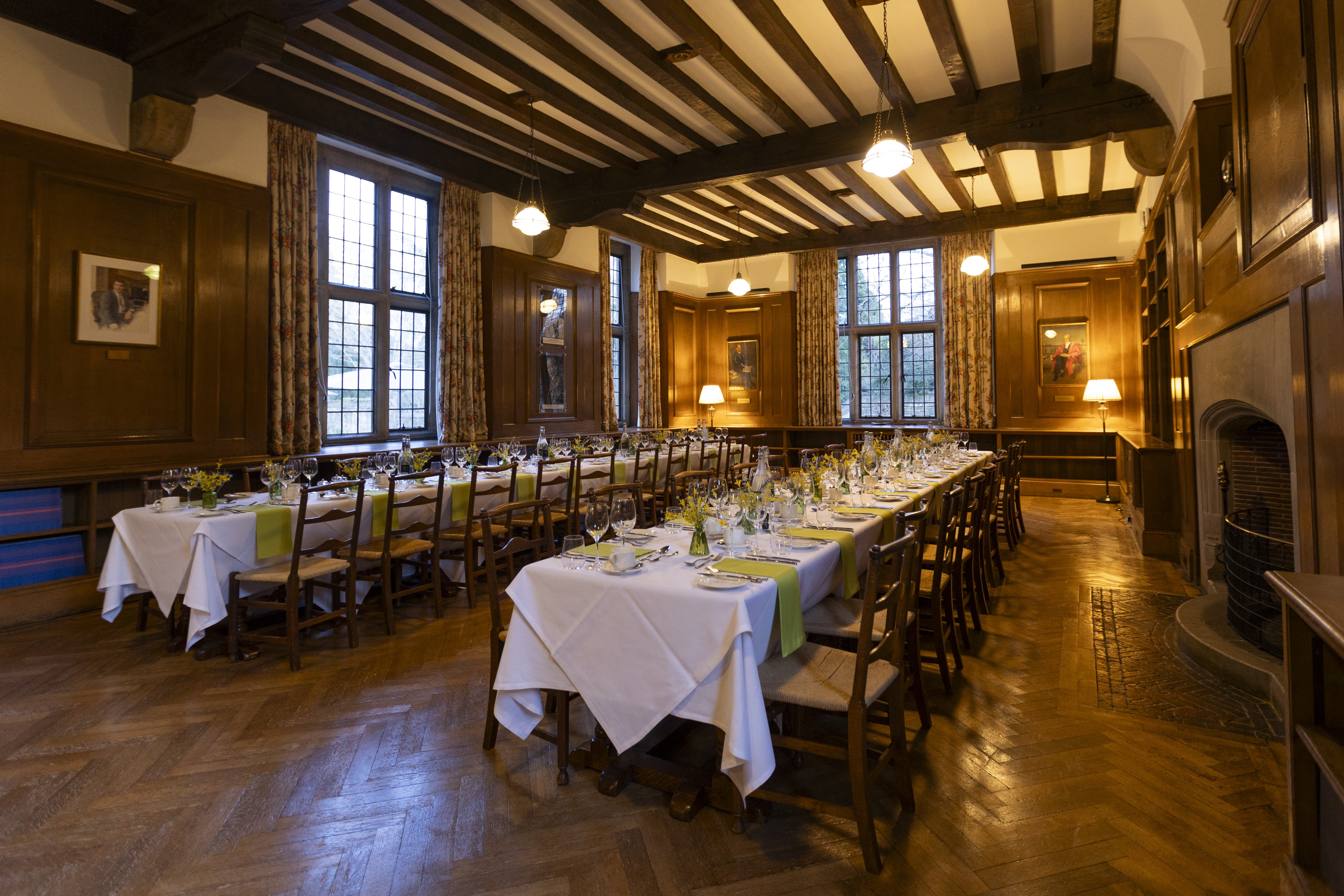 Rhodes House Beit Room dinner with two banquet tables.