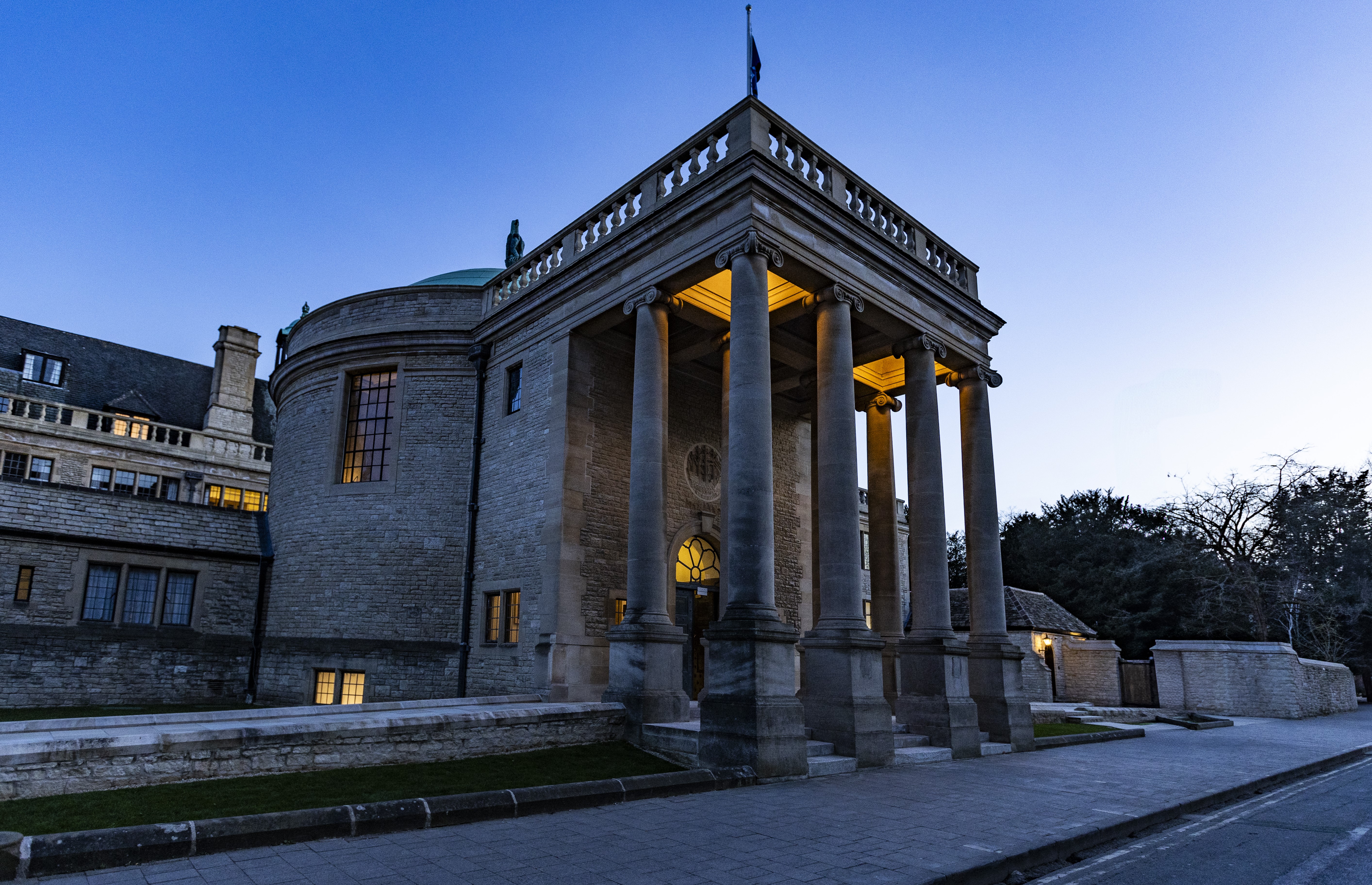Front of Rhodes House at twilight, viewed from an angle.
