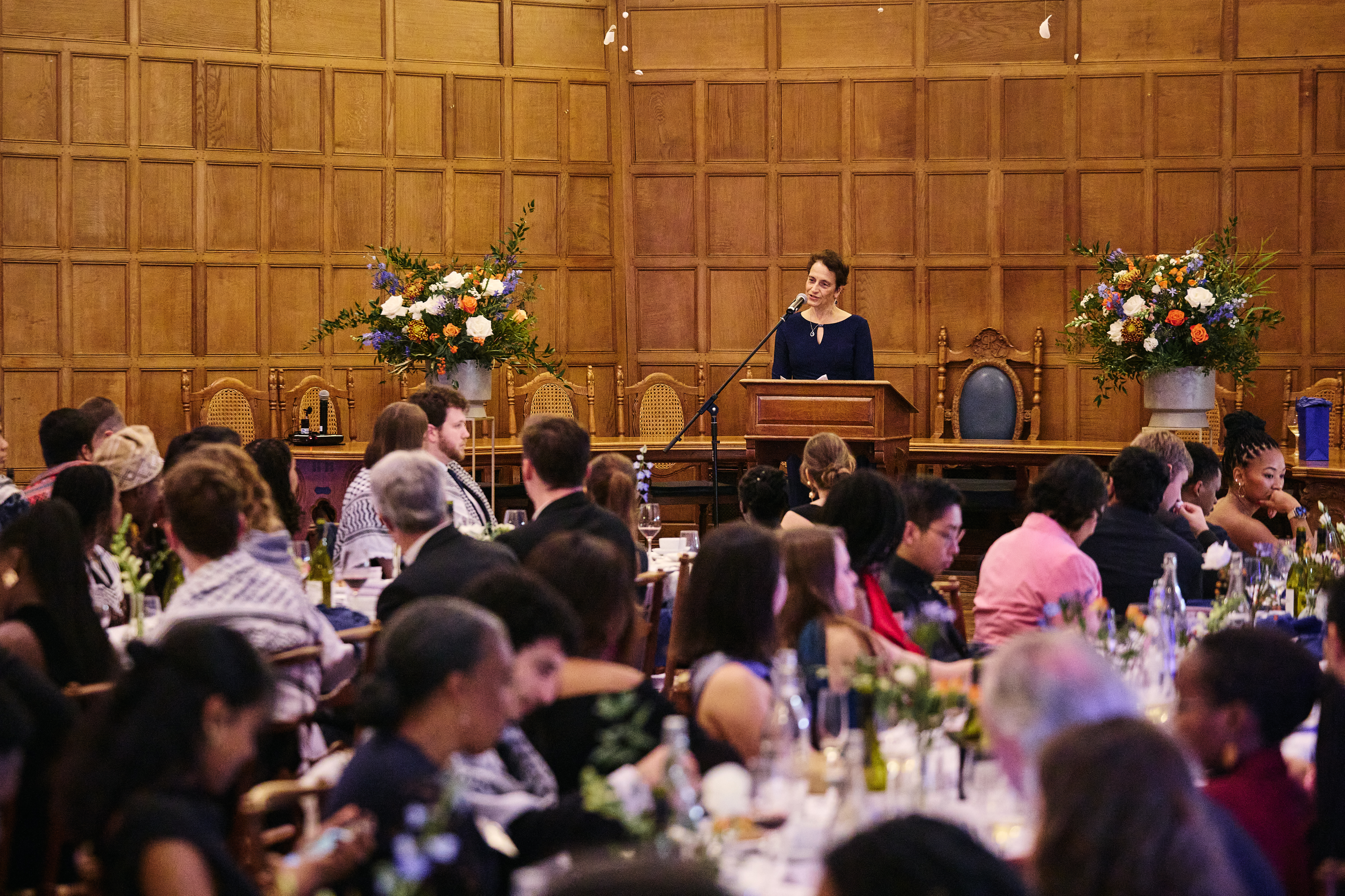 Keynote speaker giving a speech before dinner in Rhodes House McCall MacBain Hall