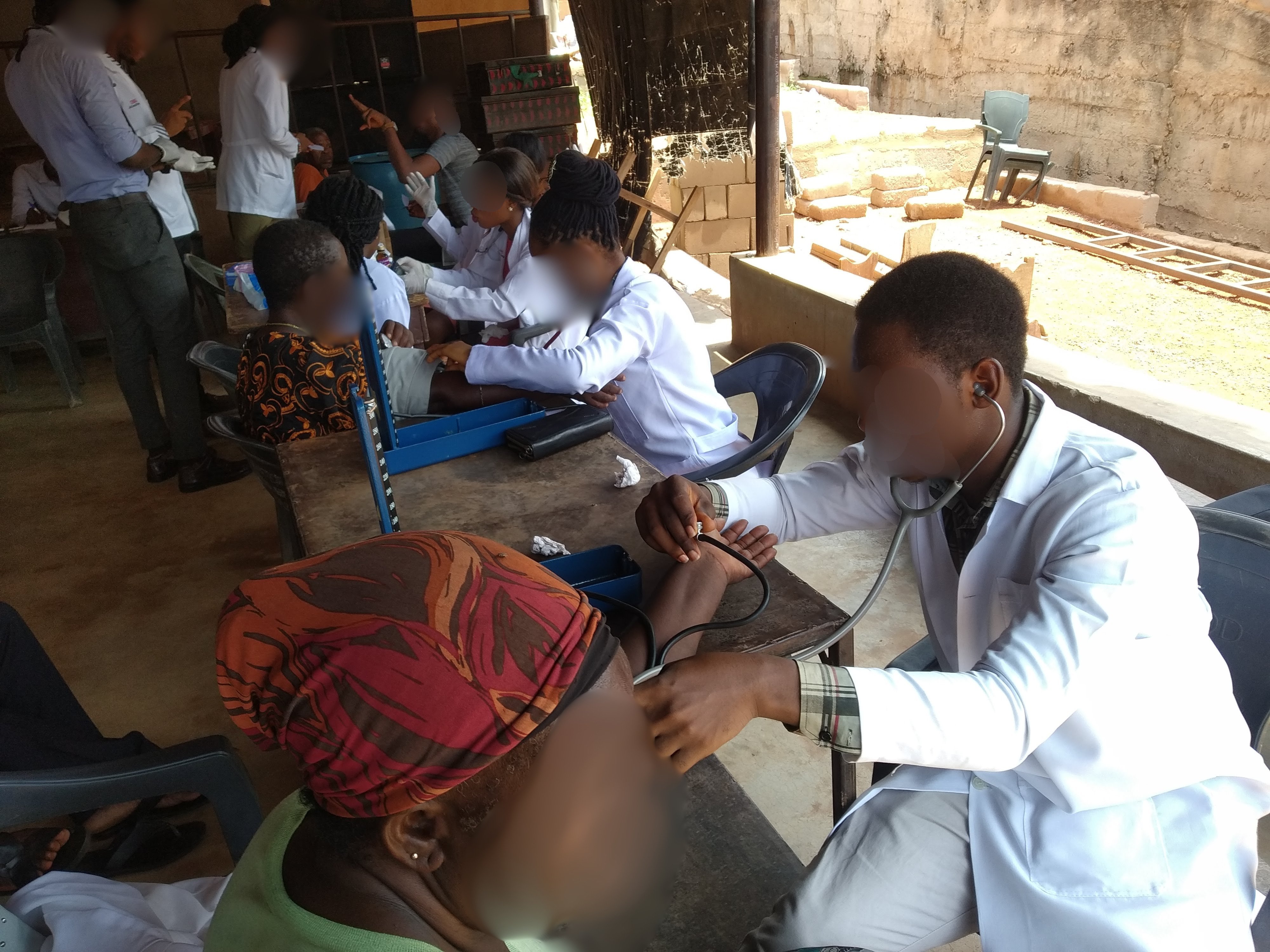Doctors and patients in Nigeria. Faces are blurred