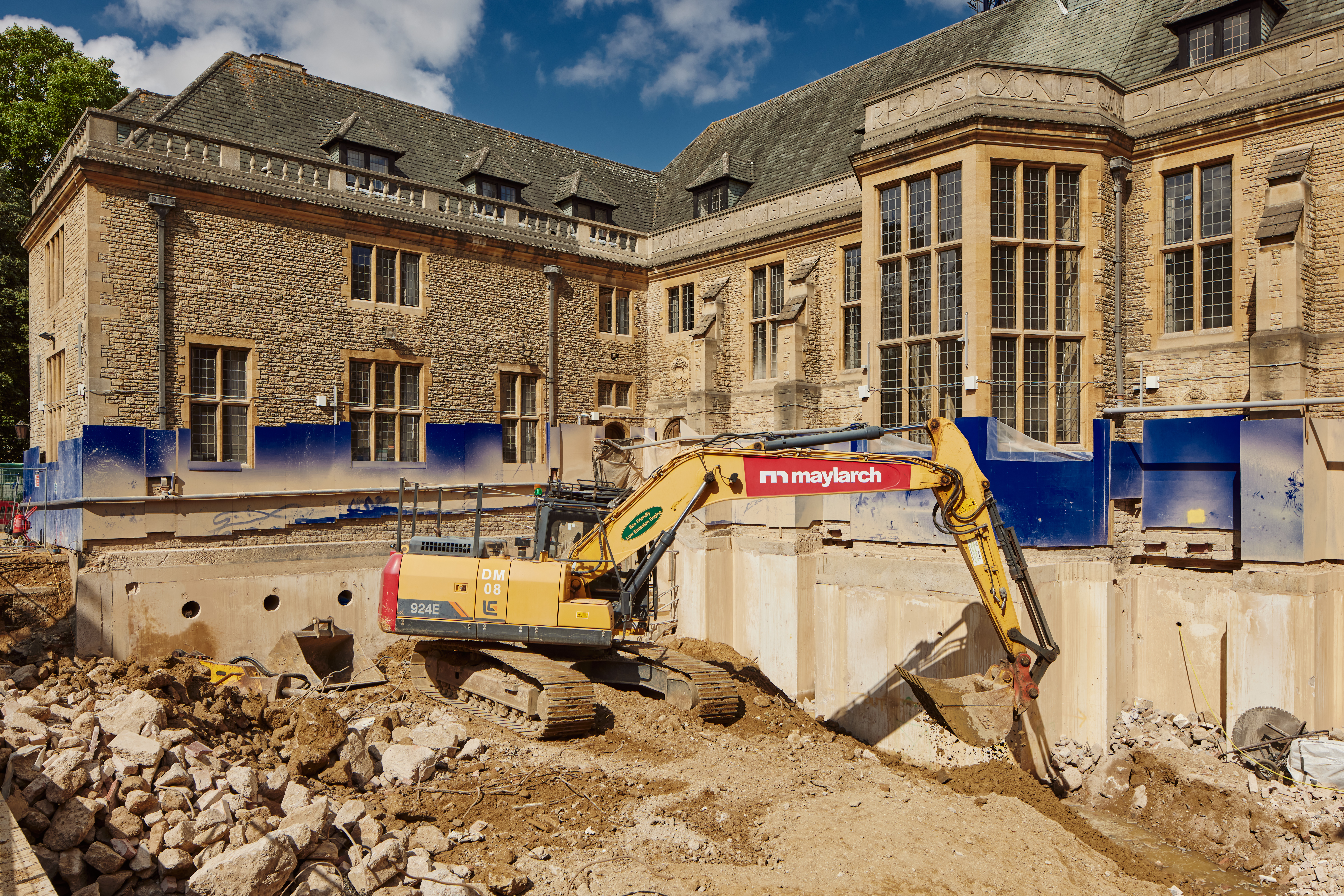 An image of an excavator digging through the 'Giant's Grave', the roof of the Rhodes House basement.