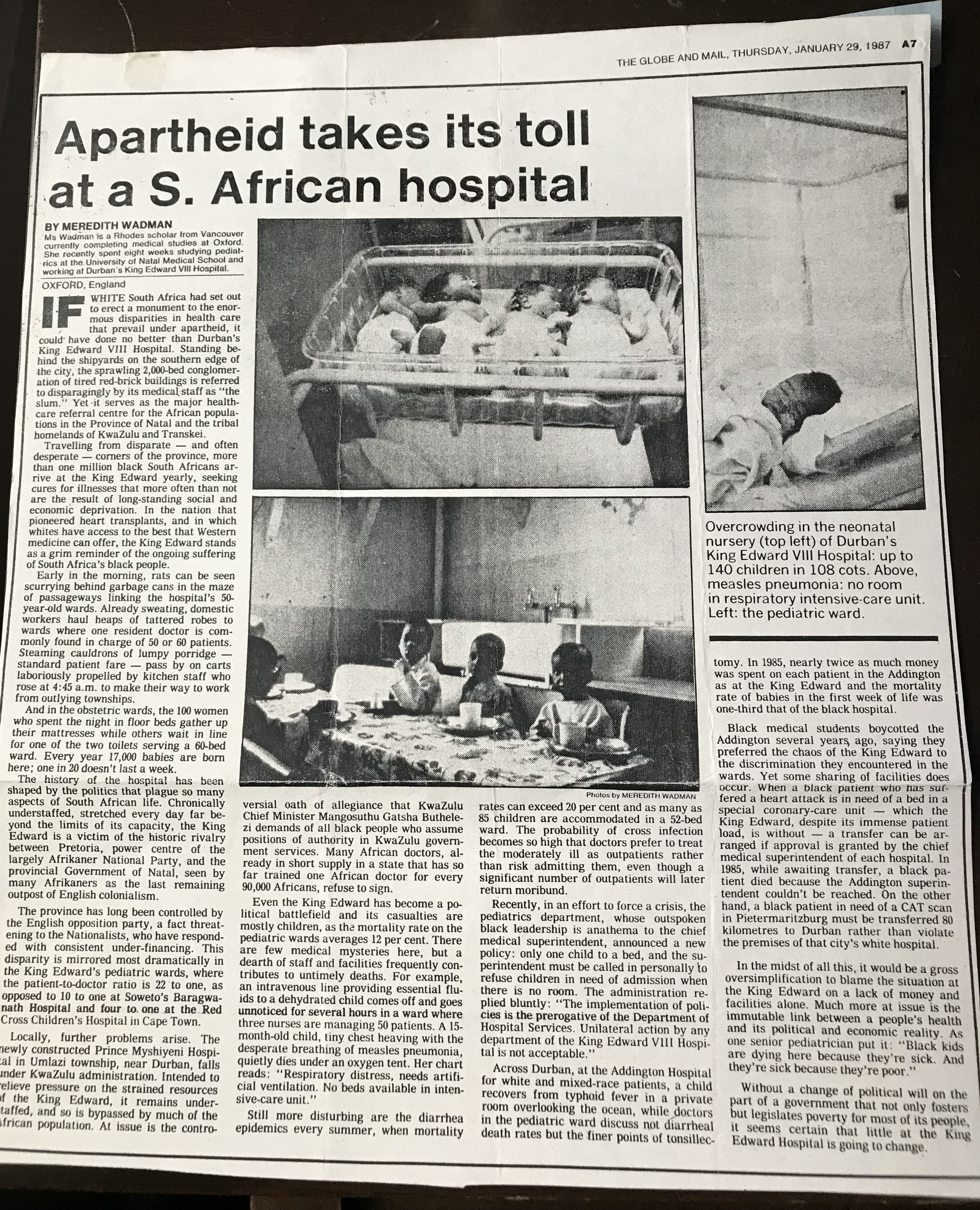 Photo of a newspaper article titled 'Apartheid takes its toll at a S. African hospital'. Black and white photos of children on the hospital ward can be seen.