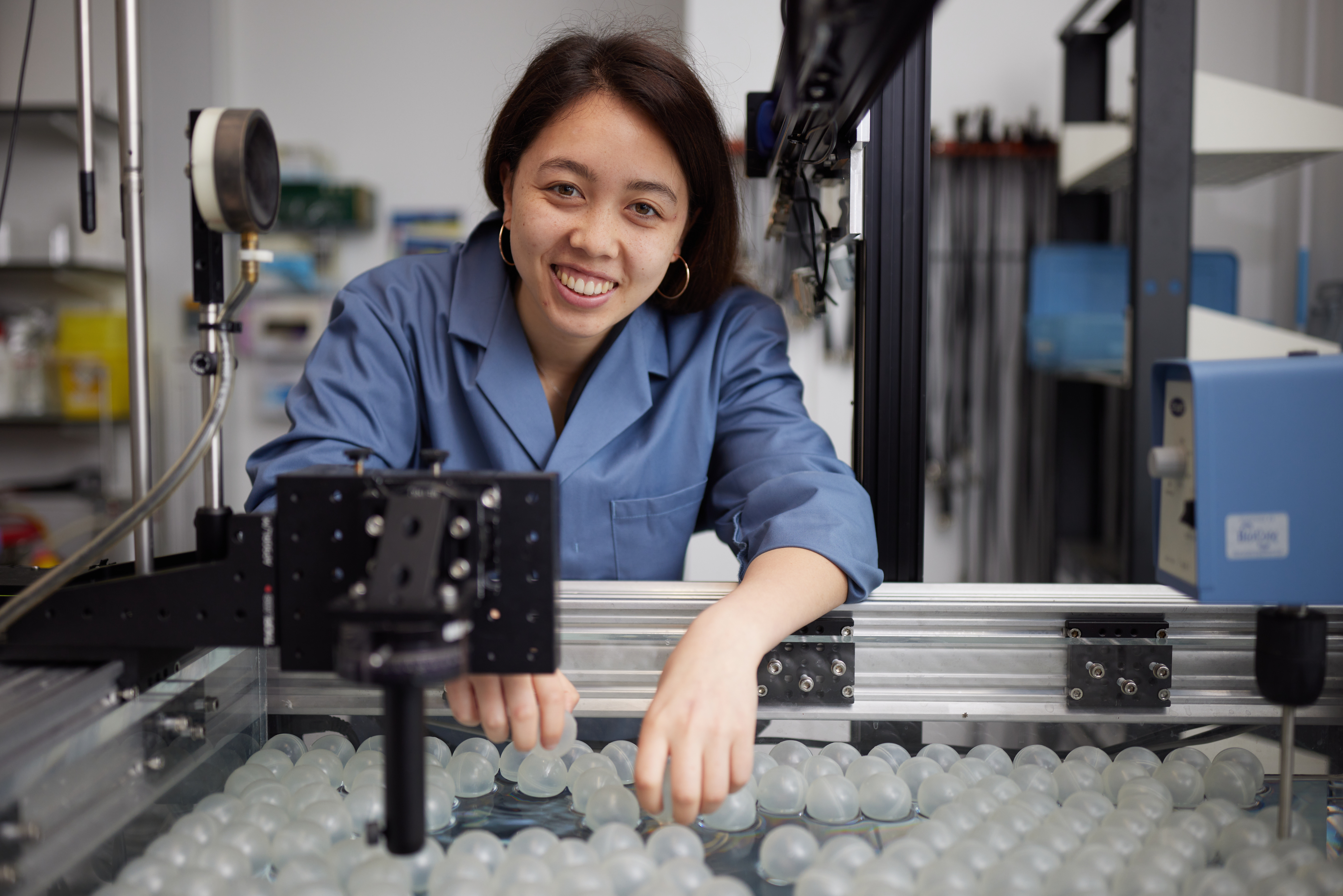 A woman in a lab coat in a laboratory at Oxford