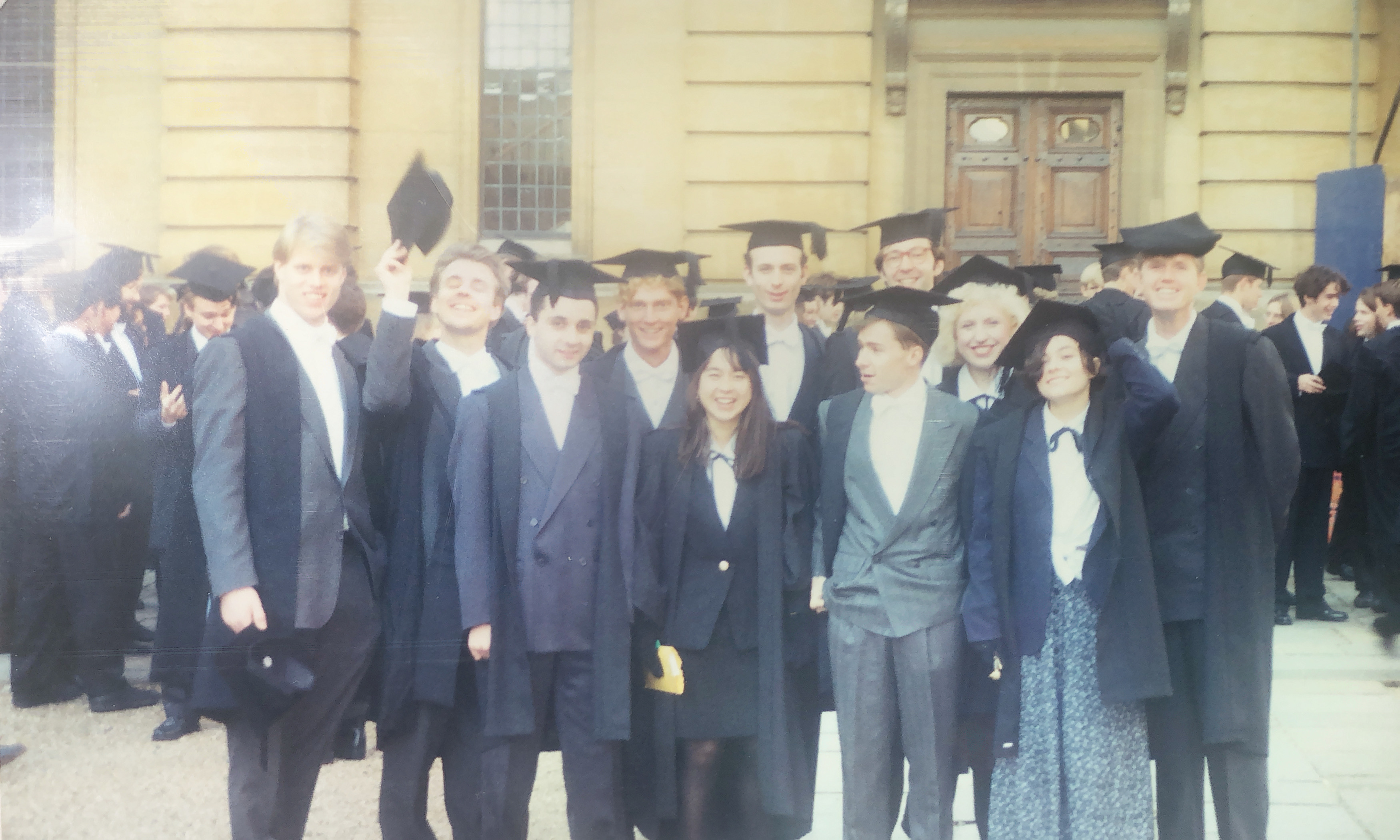 Karen stood in the middle of a large group of students, all in their matriculation gowns and hats.