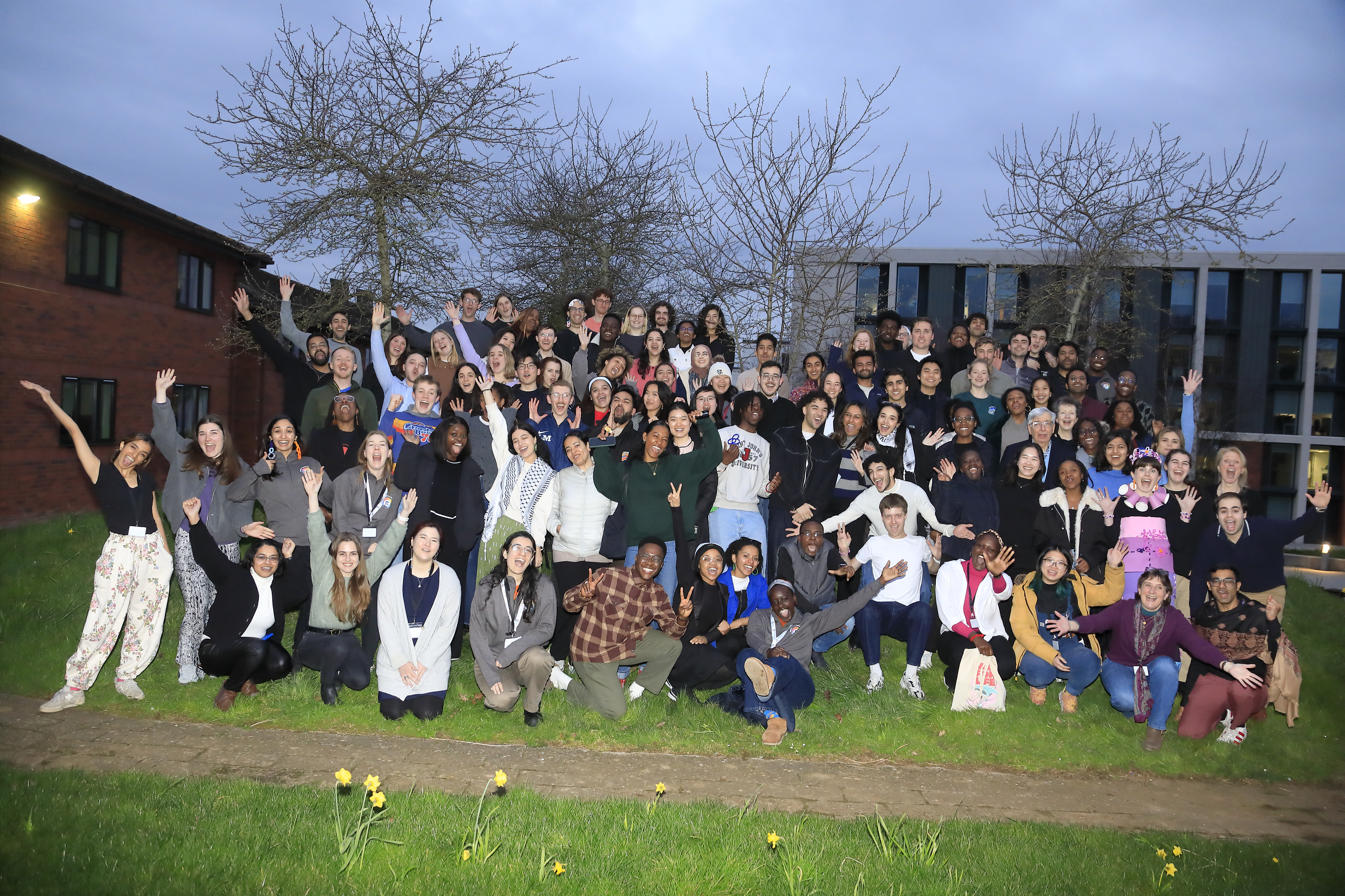 The cohort of 2024 Scholars at the end of the first year gathering, outside in a group, celebrating together. 