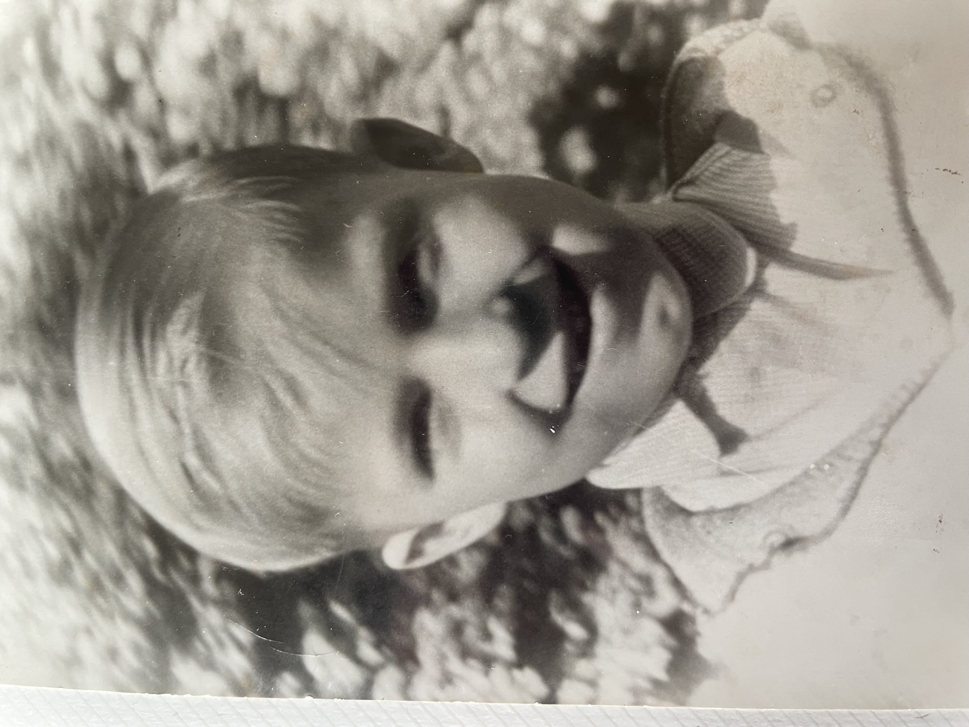 Black and white photo of Geza smiling as a young boy.
