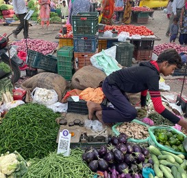 Vegetable vendor with a PhonePe QR code. PhonePe is an Indian FinTech start-up that facilitates digital payments. It relies on the Unified Payments Interface (UPI), a digital payments infrastructure developed by the Indian Government under Modi.