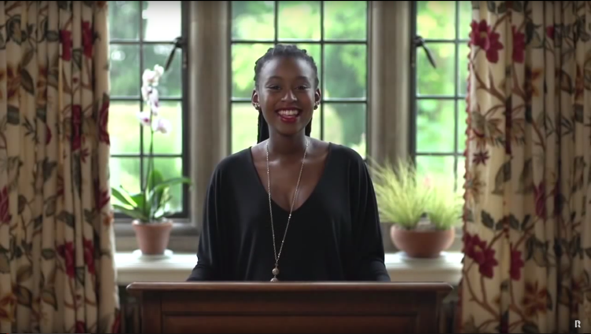 An image of Rhodes Scholar Kopano Mabaso standing at a lectern giving a speech. 