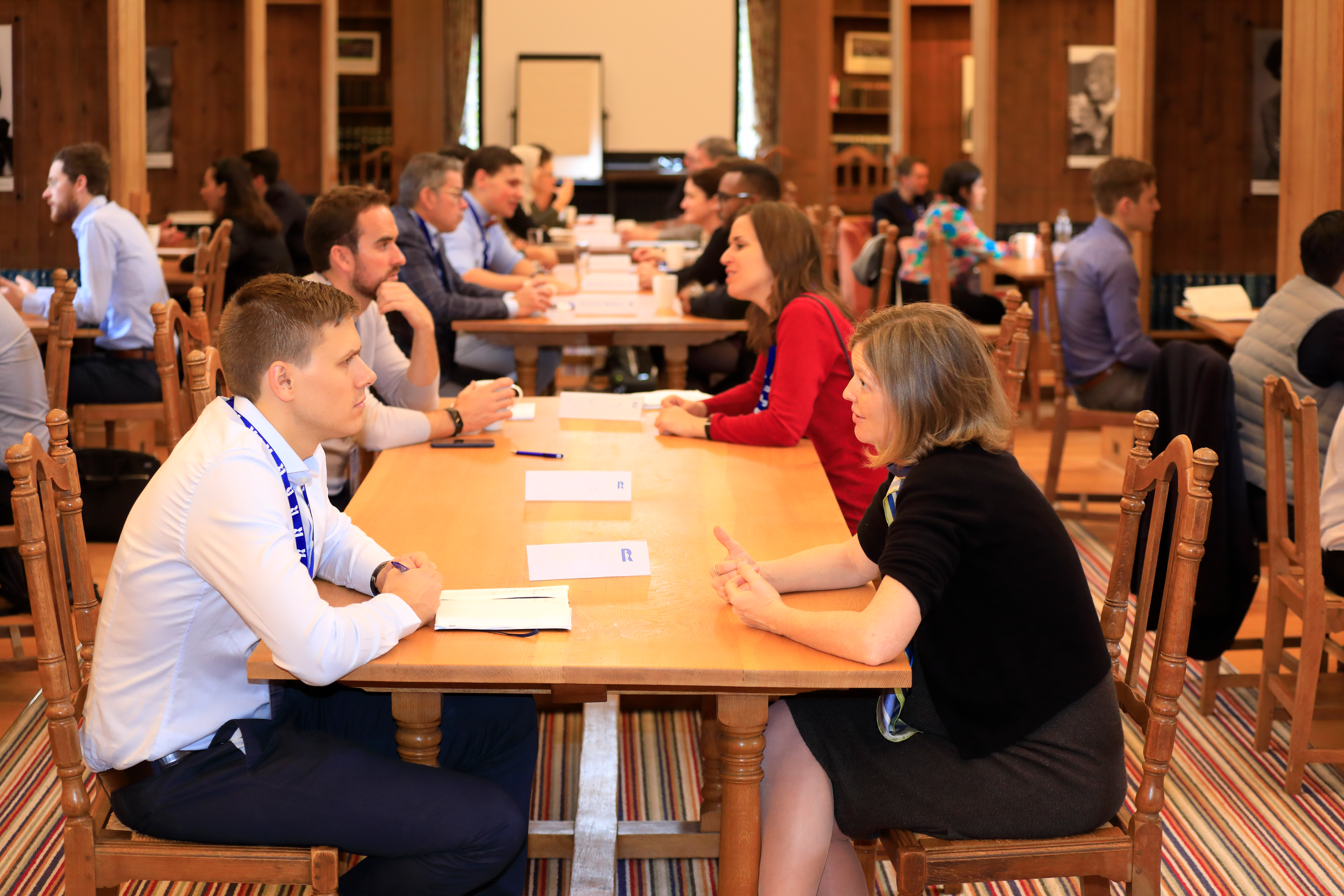 Speed mentoring with two people talking across a table