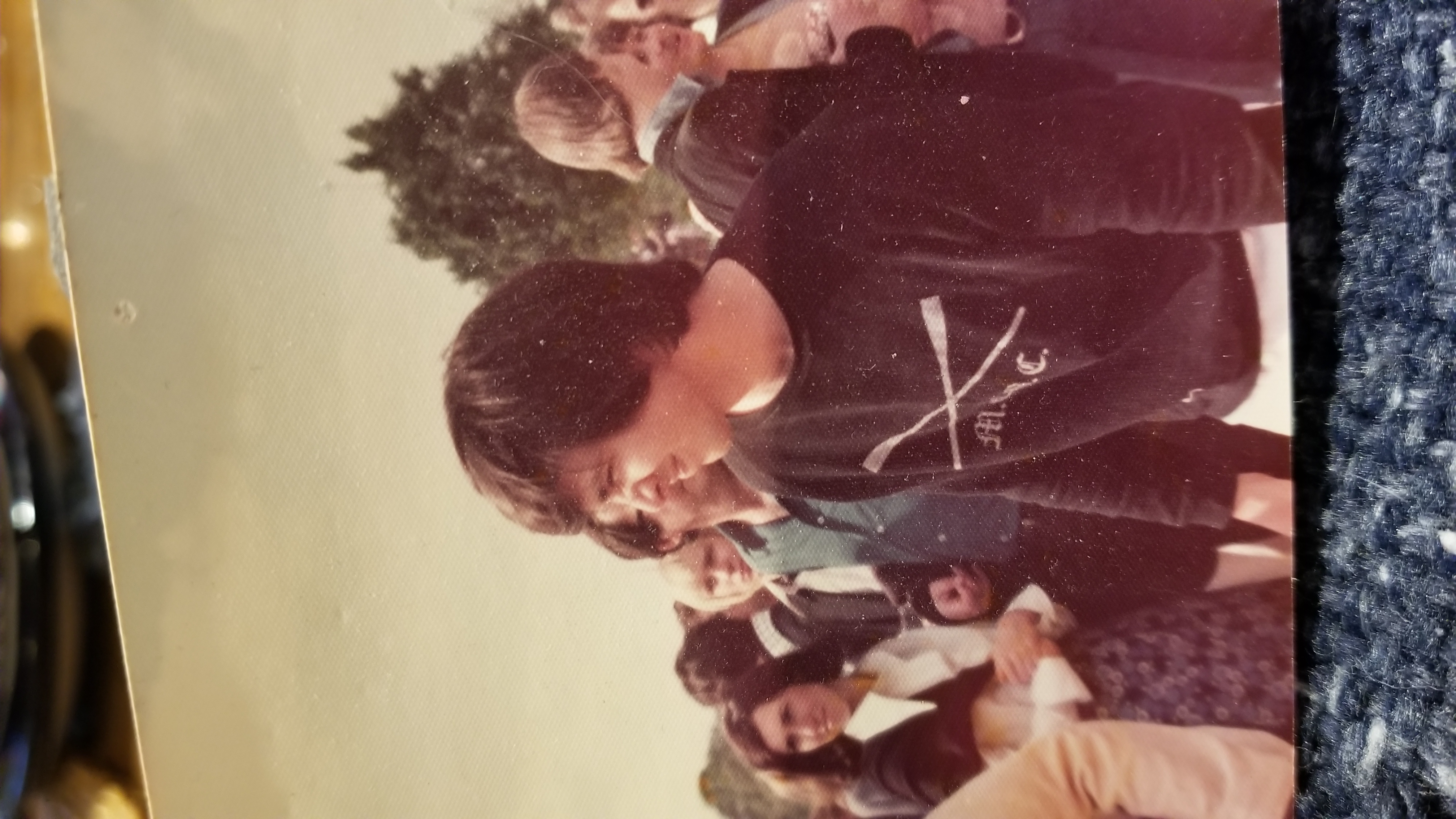 Image of Elliot wearing a sport sweatshirt in a crowd.