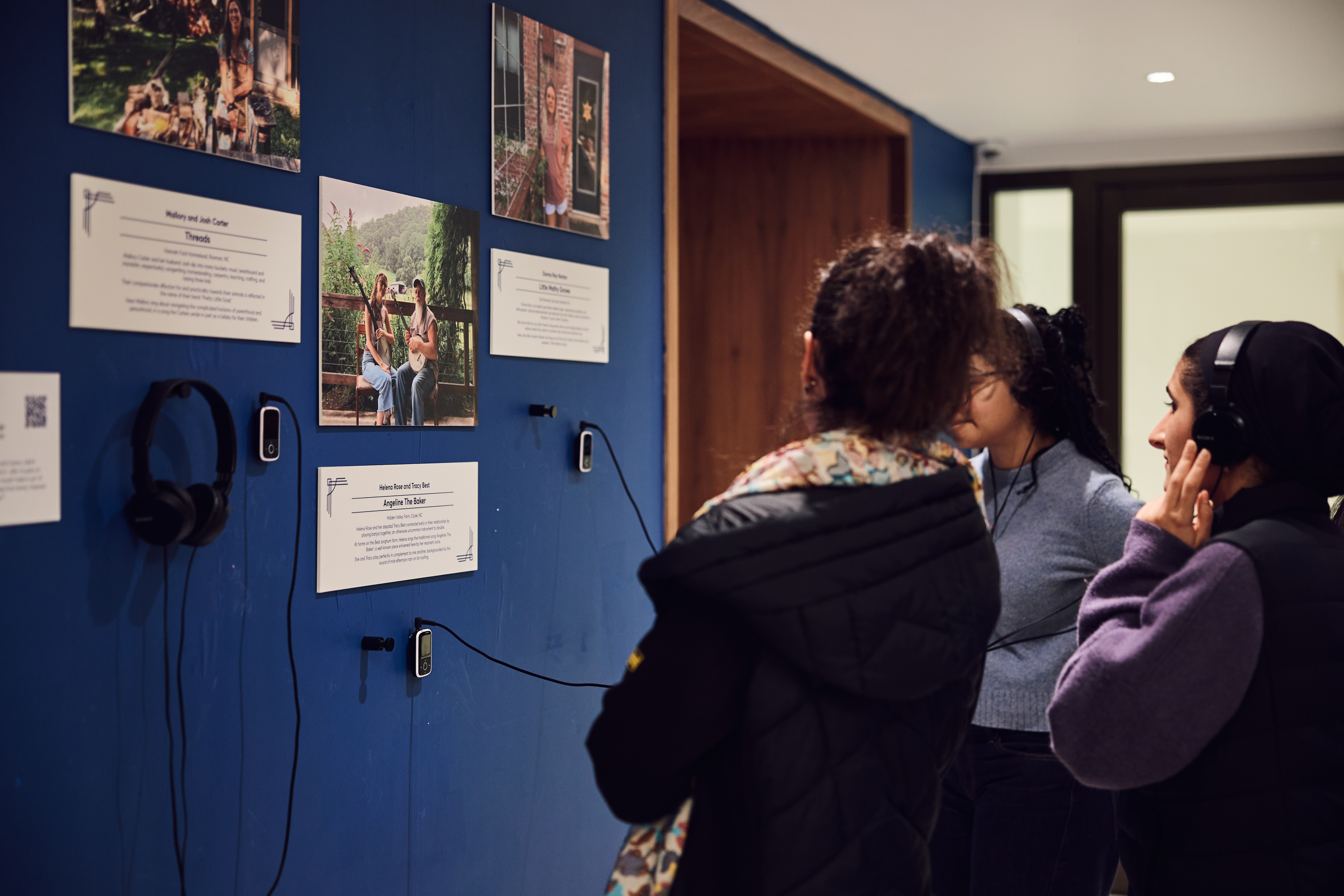 People looking at artworks