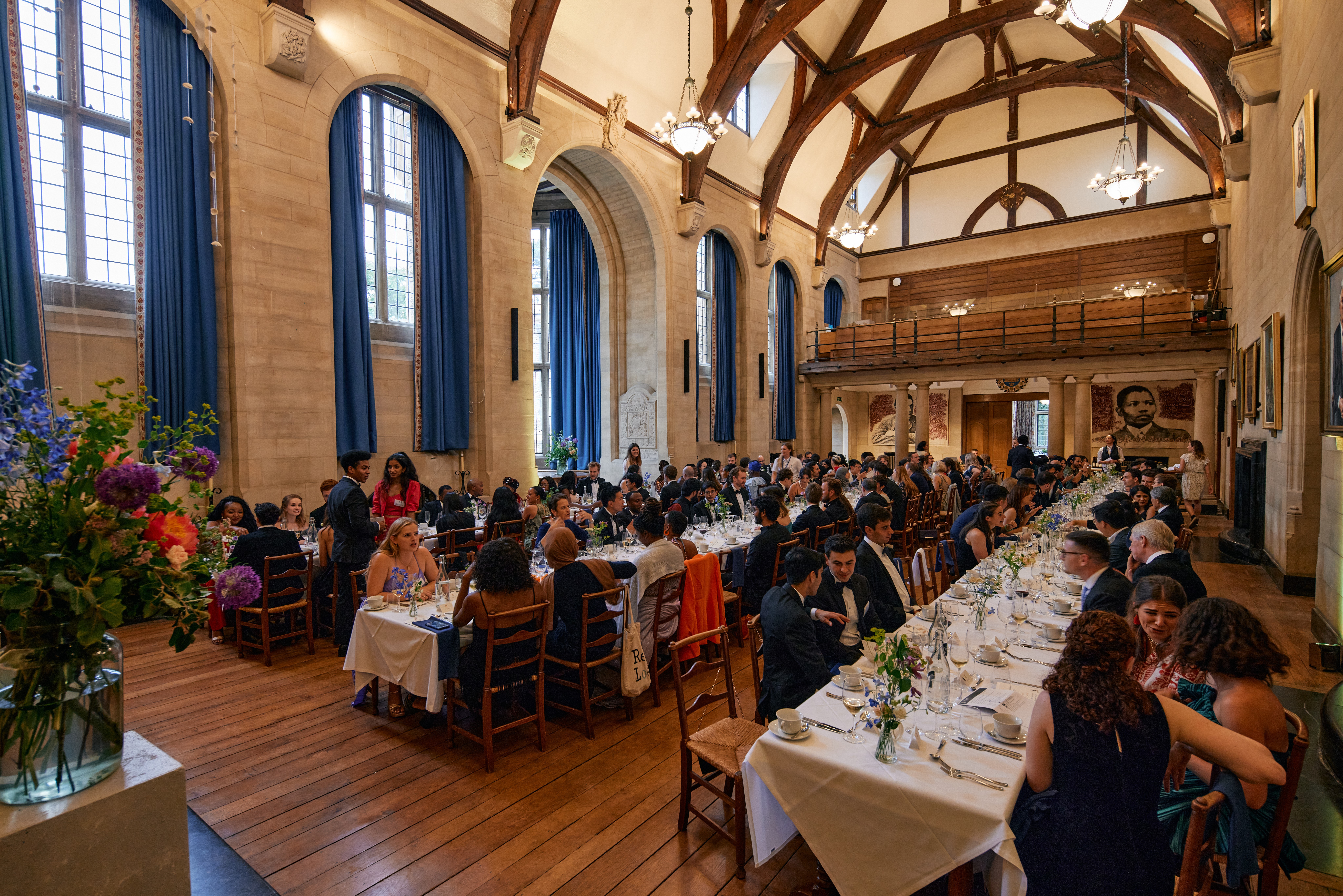 Rhodes House McCall MacBain Hall dining guests on long banquet tables