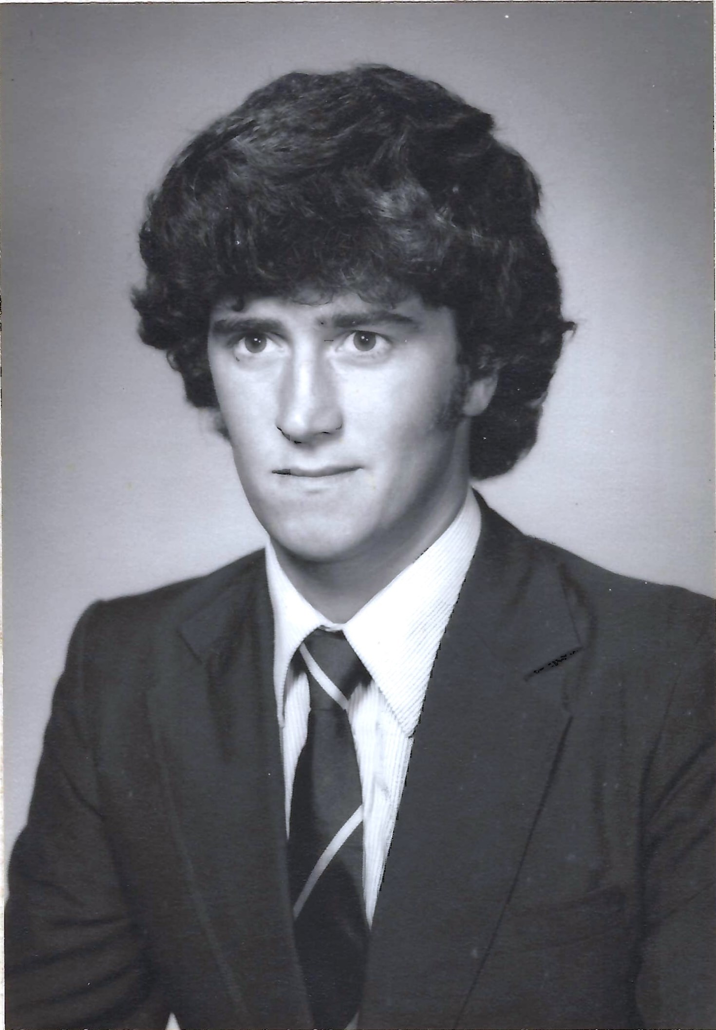 A black-and-white portrait of John