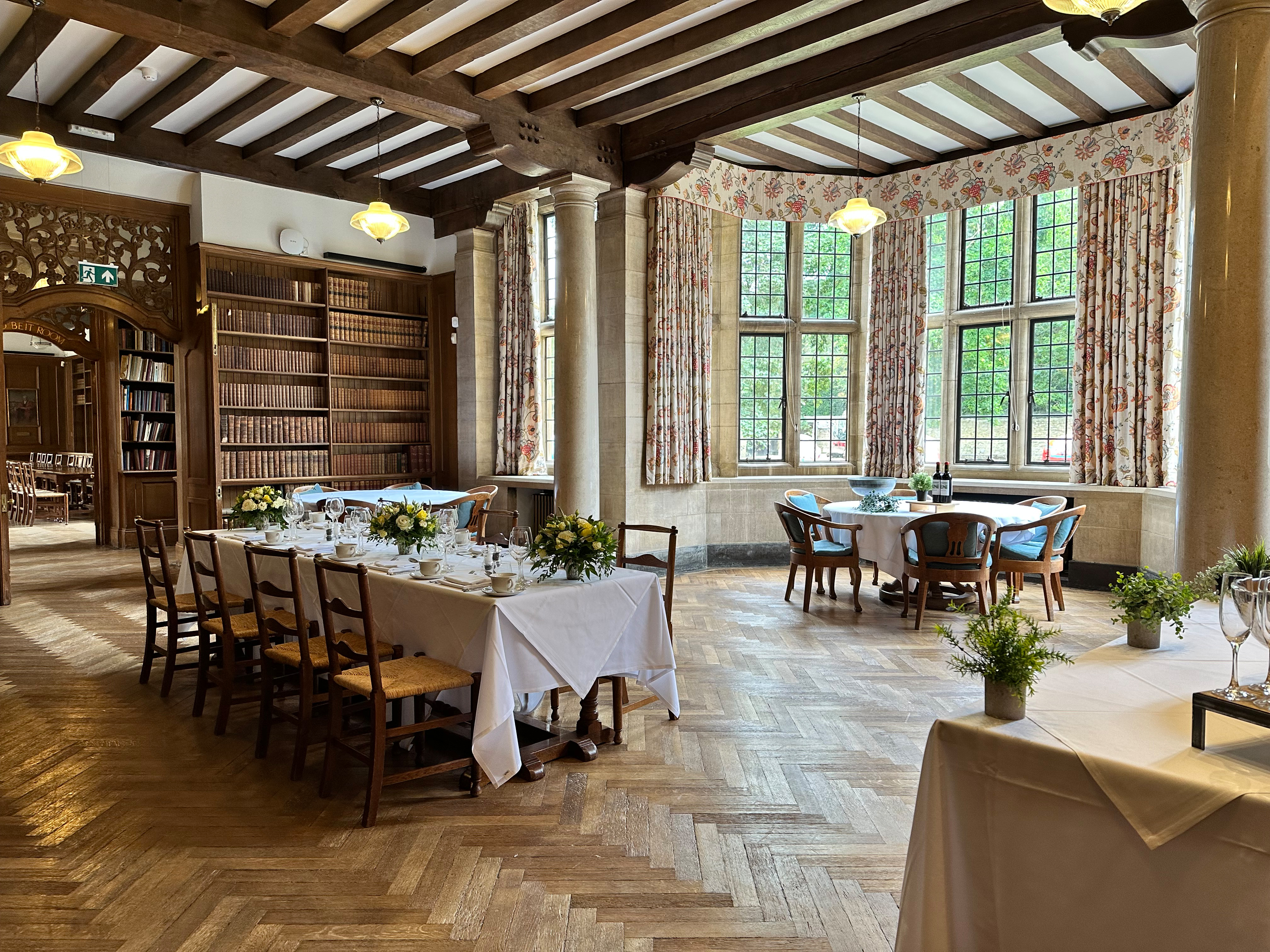 Tables set for private dining in the Rhodes House Reception Room.