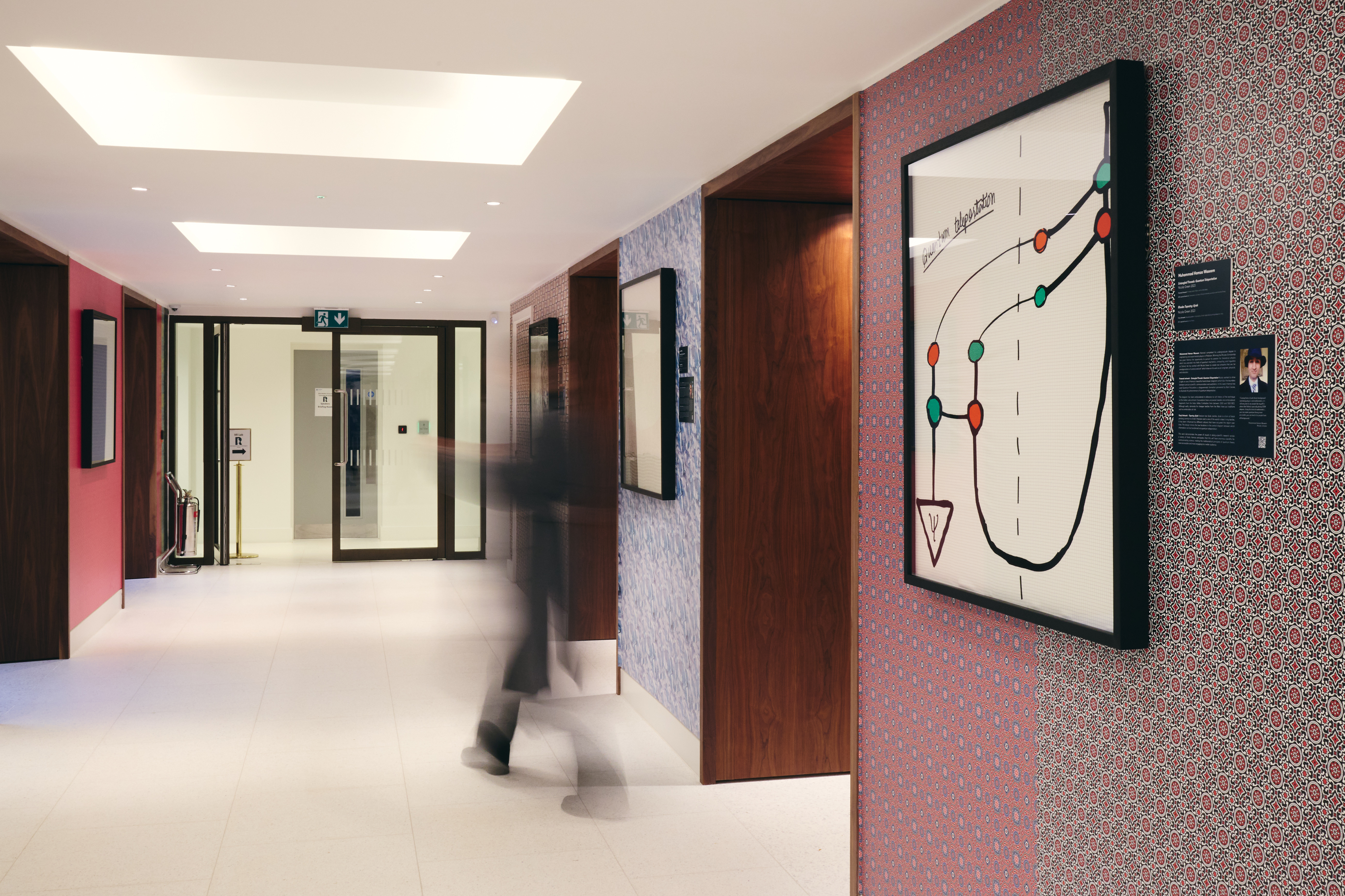 Guests walking through the corridor holding the exhibition