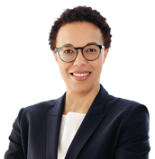 Photo of Inosi Nyatta in a suit and glasses smiling
