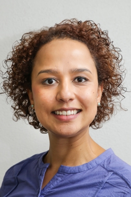 Close up headshot style photo of Mandisa smiling into the camera.