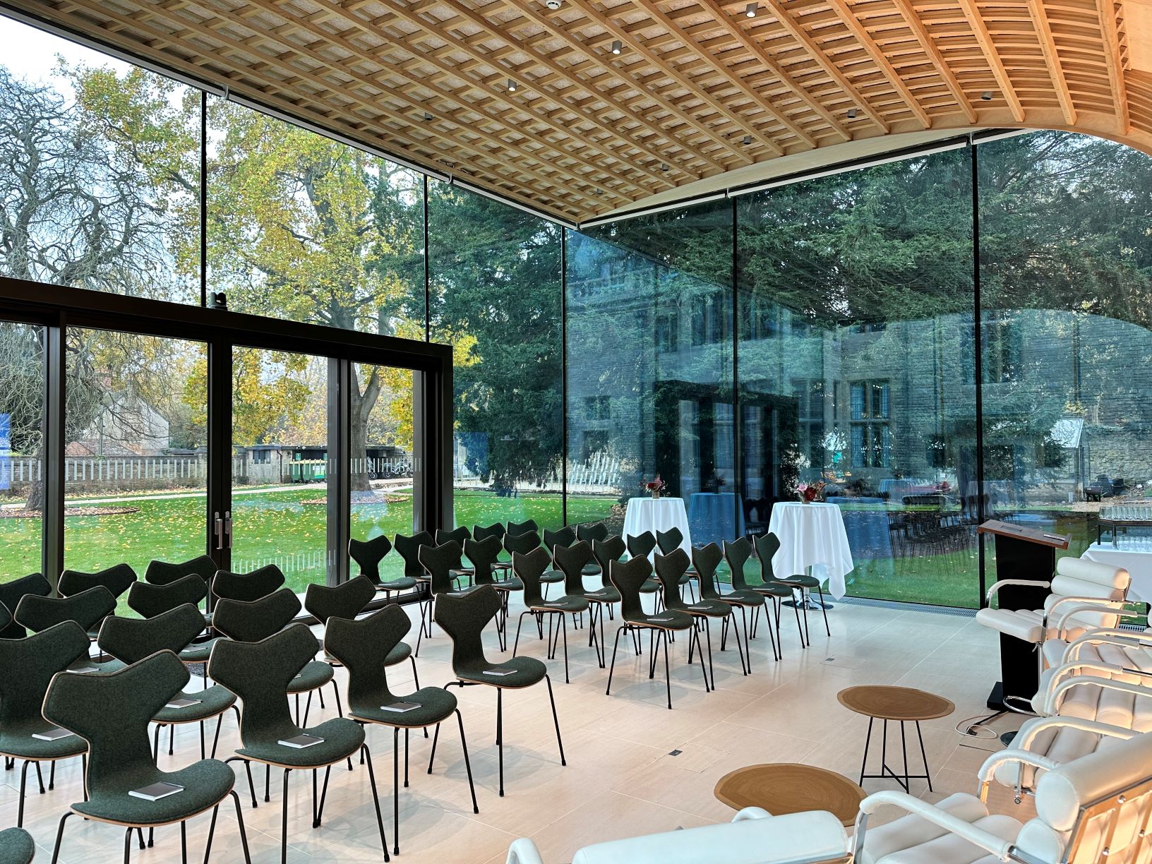 Rhodes House Glass Pavilion set up for a meeting with theatre style seating.