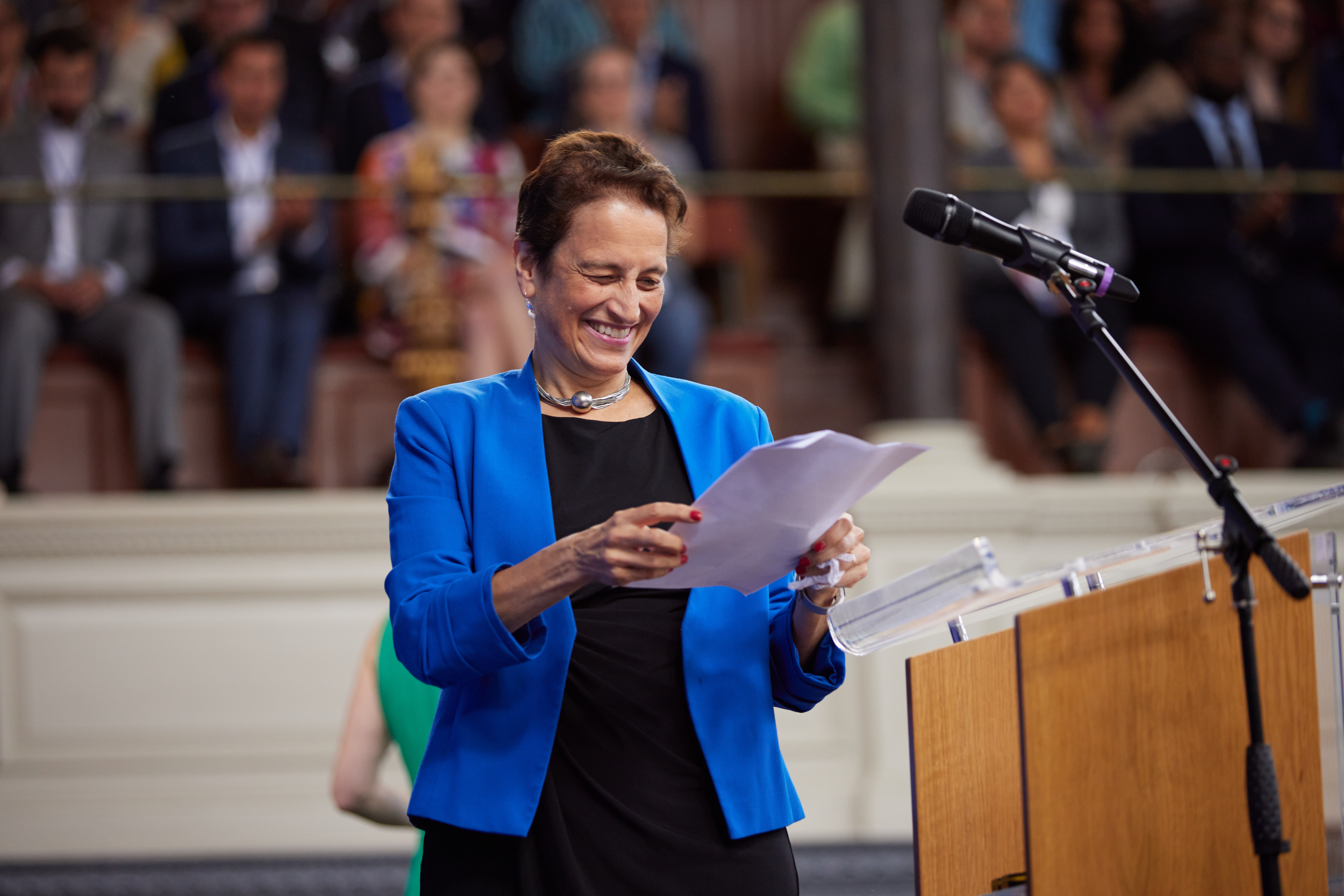 Image of Elizabeth Kiss, the Rhodes warden and CEO of Rhodes Trust standing at a podium