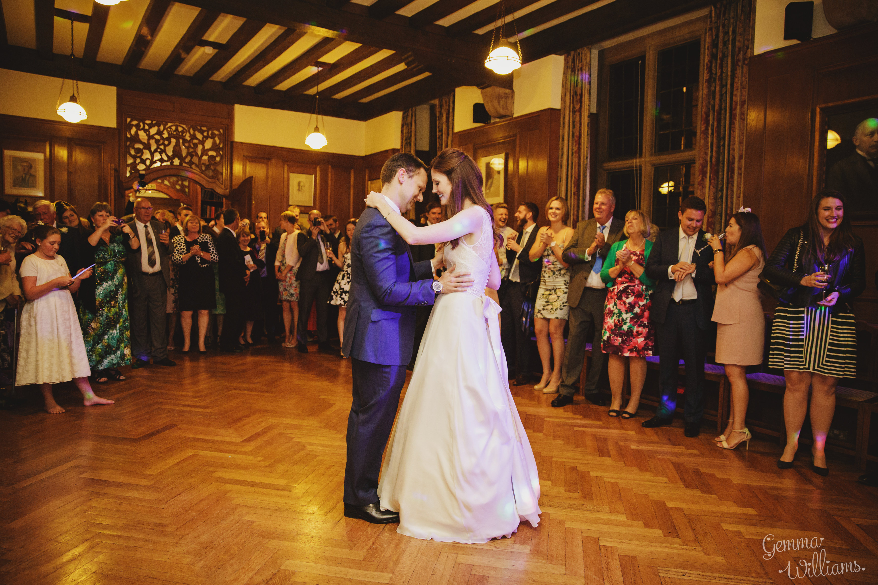 Wedding couple having their first dance in the Rhodes House Beit Room surrounded by guests, photo courtesy Of Gemma Williams Photography