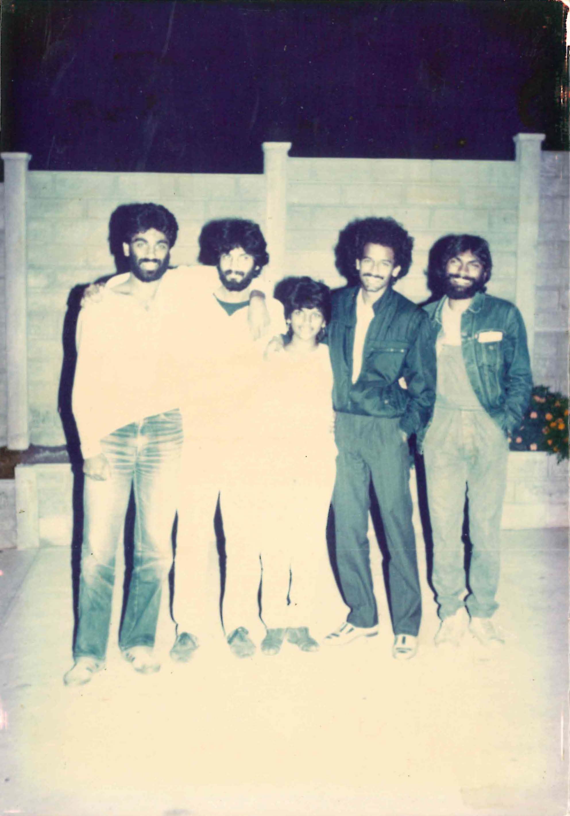 The picture is faded and shows a group of boys in shirts and baggy jeans