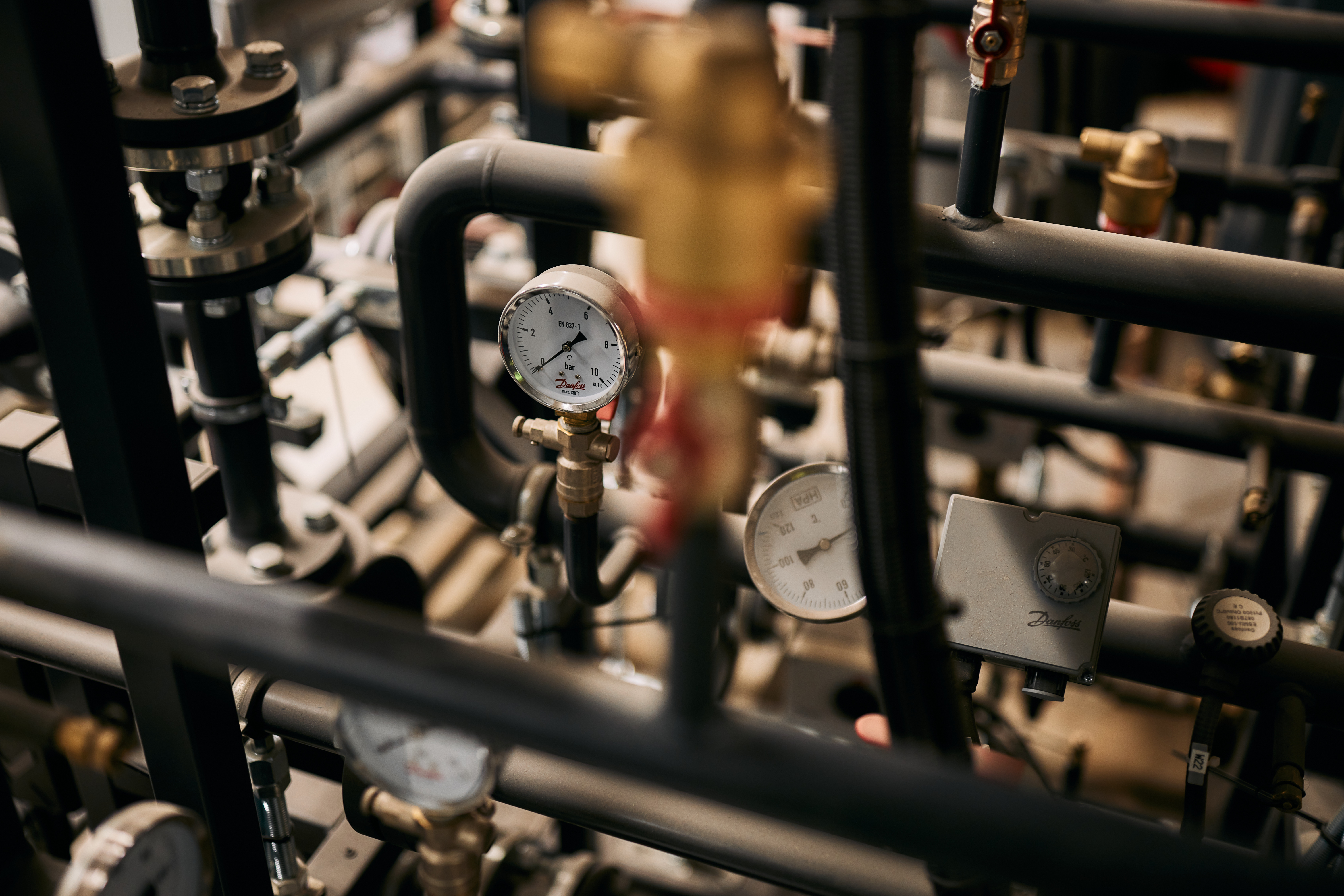 Close up photo of plumbing pipes at Rhodes House