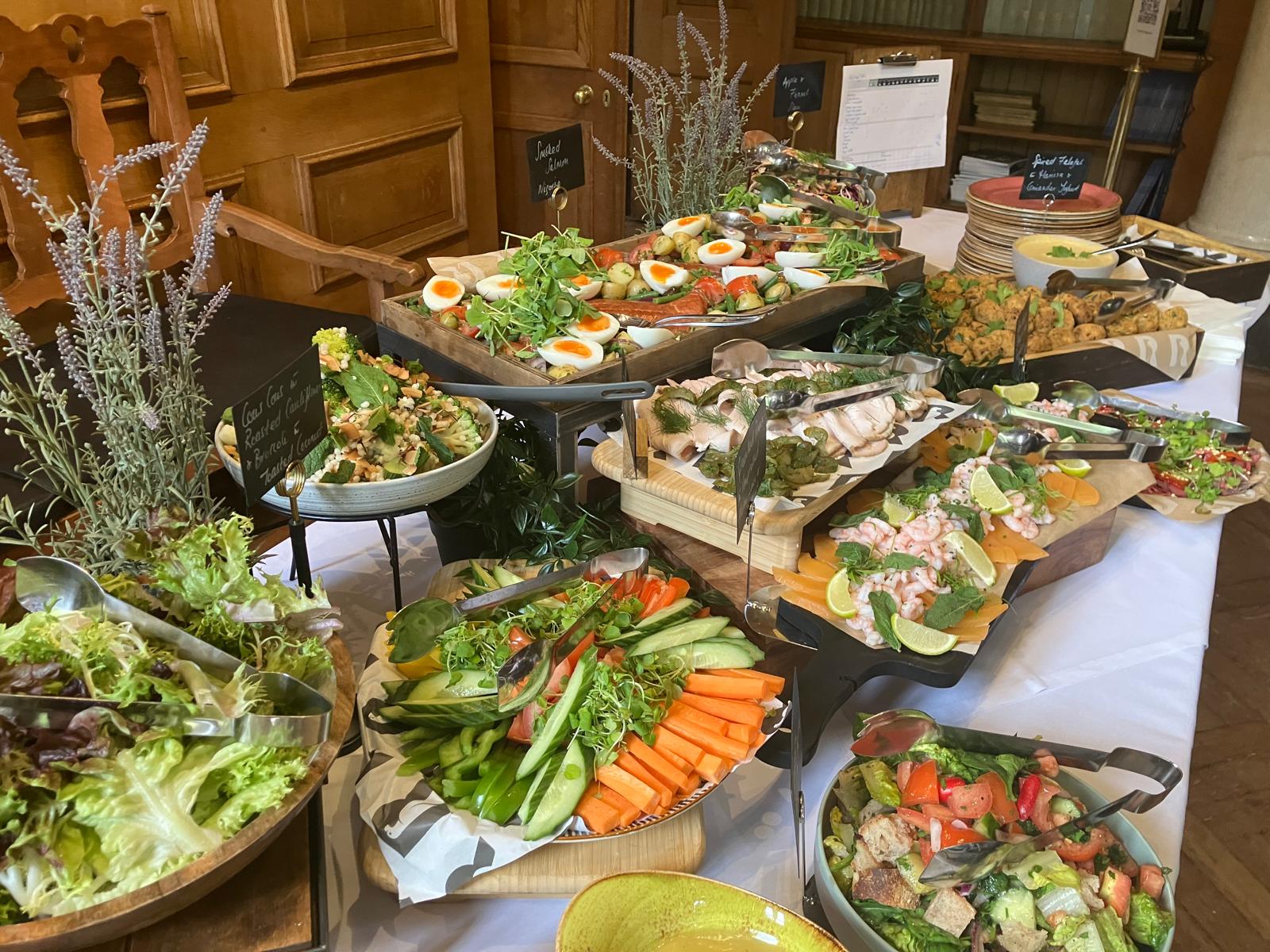 Food set out for a buffet lunch. 