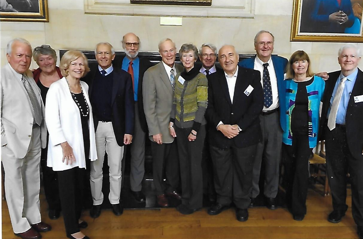 A picture showing a group of Rhodes Scholars, smartly dressed and smiling.
