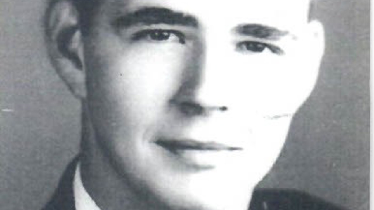 A black-and-white headshot of Norton