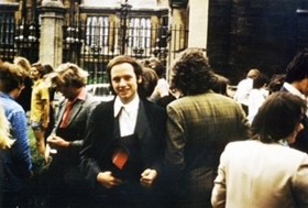 A picture showing Gary in a crowd of people outside a building in Oxford. He is wearing a subfusc.