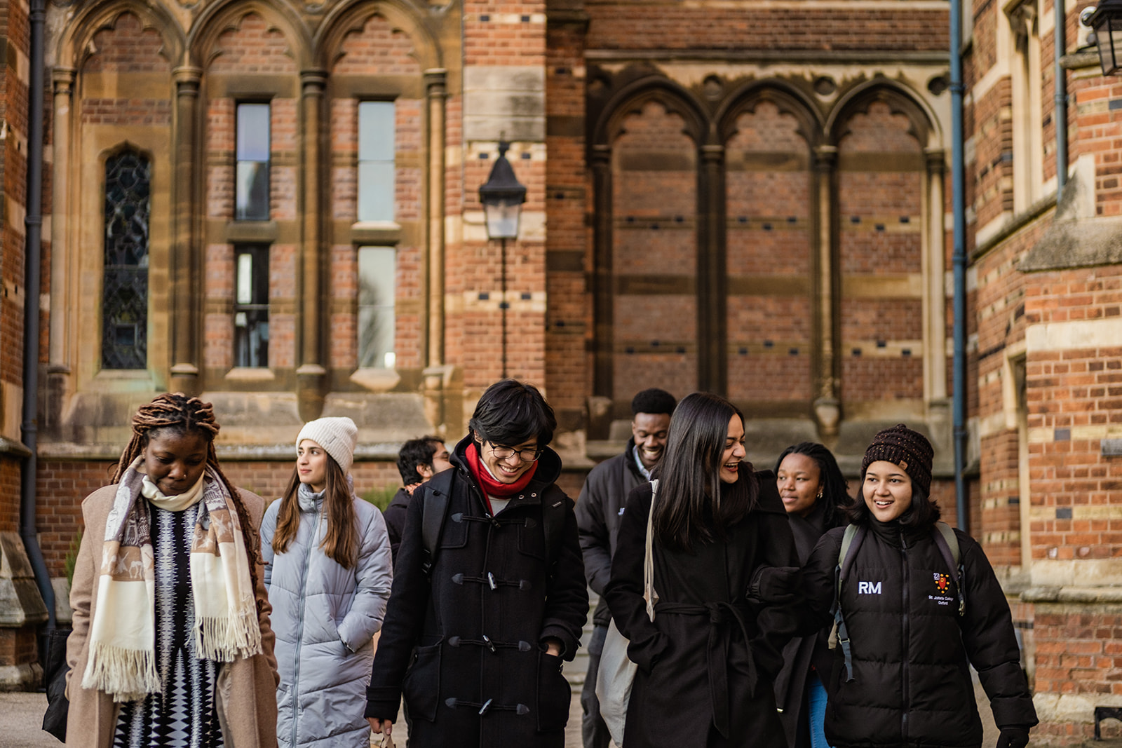 A candid photograph of a group of Rhodes Scholars walking around the university.
