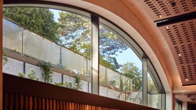 Conference Hall clerestory window looking out to the Rhodes House garden in daylight.
