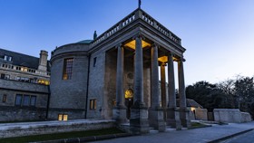 Front of Rhodes House at twilight, viewed from an angle.