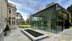 View of the Glass Pavilion and the west terrace area and outside of the Reception Room bay window.