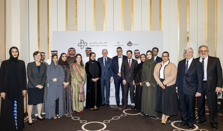 Group photo from Ideas Abu Dhabi featuring UAE Rhodes Scholars, Rick Trainor, CEO & Warden of the Rhodes Trust, Former President Bill Clinton and representatives from the Clinton Global Initiative, and the Salama bint Hamdan Al Nahyan Foundation.