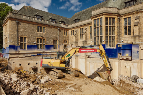 An image of an excavator digging through the