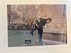 Photo of Nick and Marla smiling, with Nick holding Marla up over his shoulder.