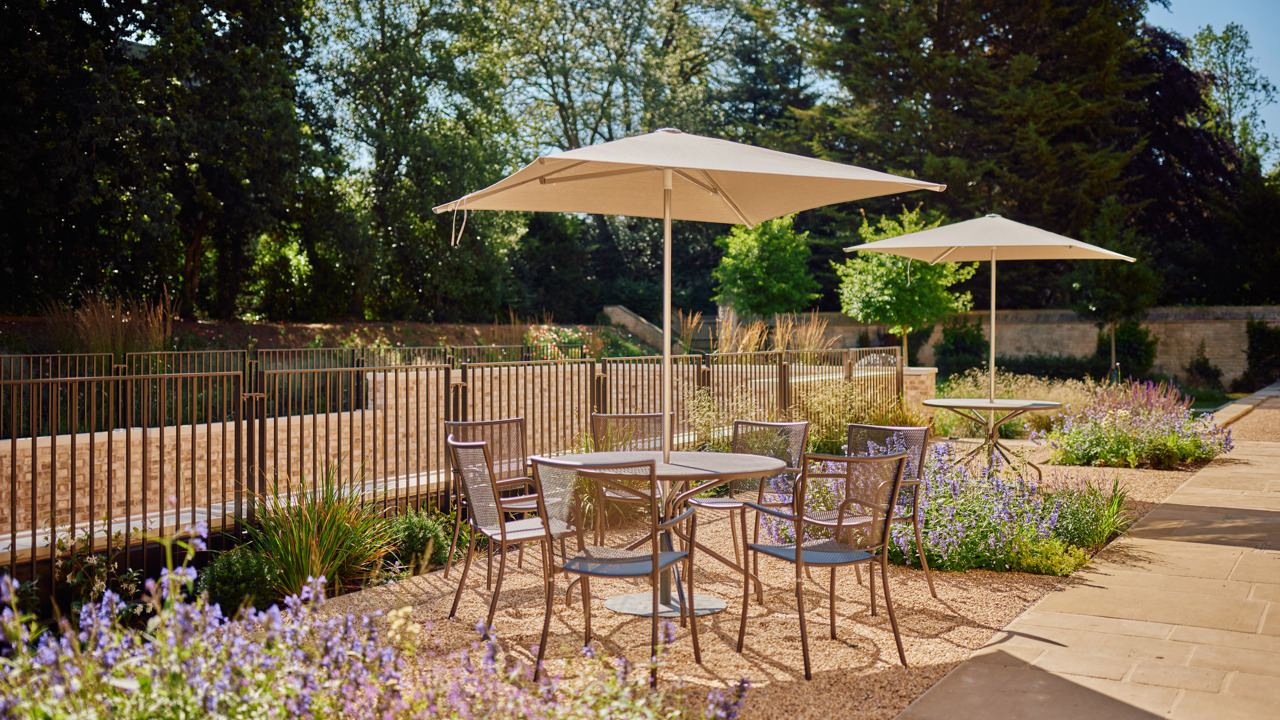 Table And Chairs In A Sunny Rhodes House Terrace