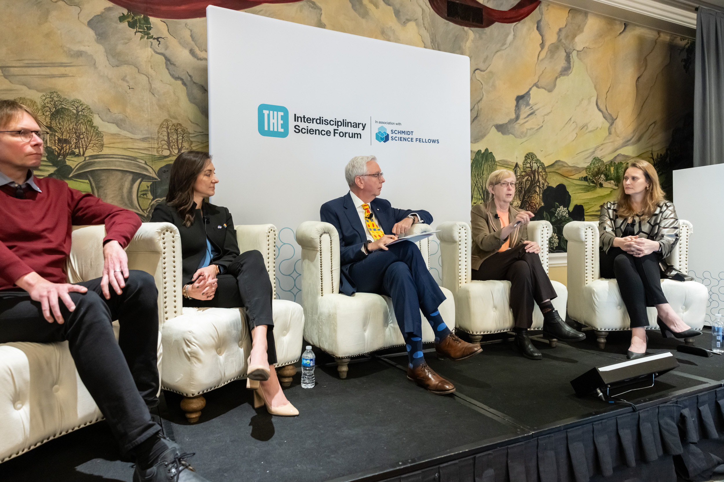 Five panellists in discussion on recognising and rewarding interdisciplinary achievement.