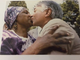The picture shows Moni kissing Winnie Mandela on the lips in a traditional greeting.