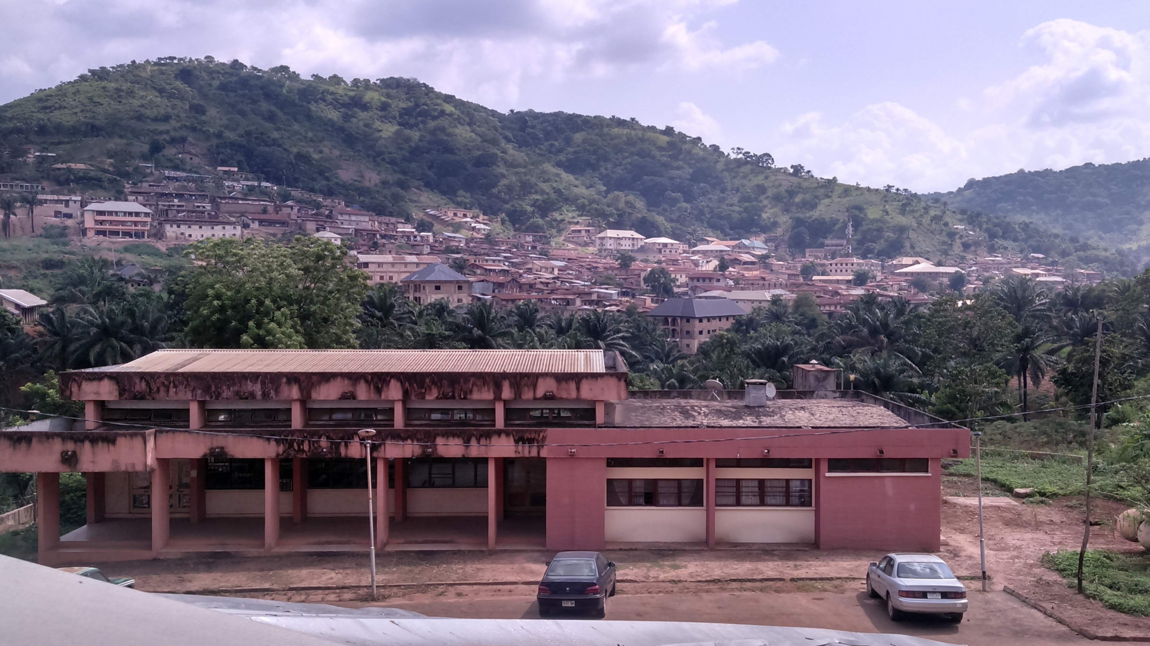 A building in Nigeria with mountains in the background