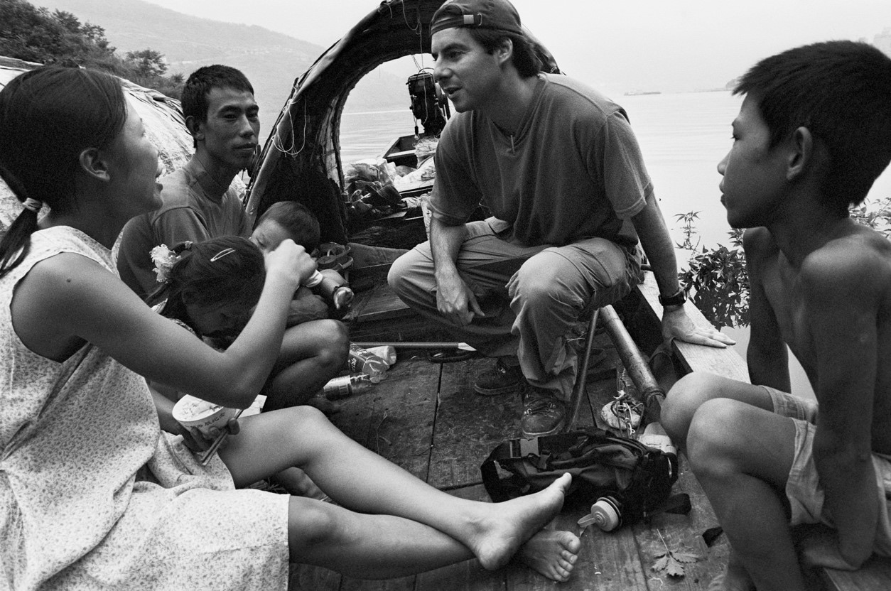 Peter Hessler on the Daning River, a tributary of the Yangtze River, interviewing the Huangs, a fishing family, for a New Yorker story, July 2003