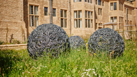 Image of Gogel Garden sculptures which are 2 round metallic balls
