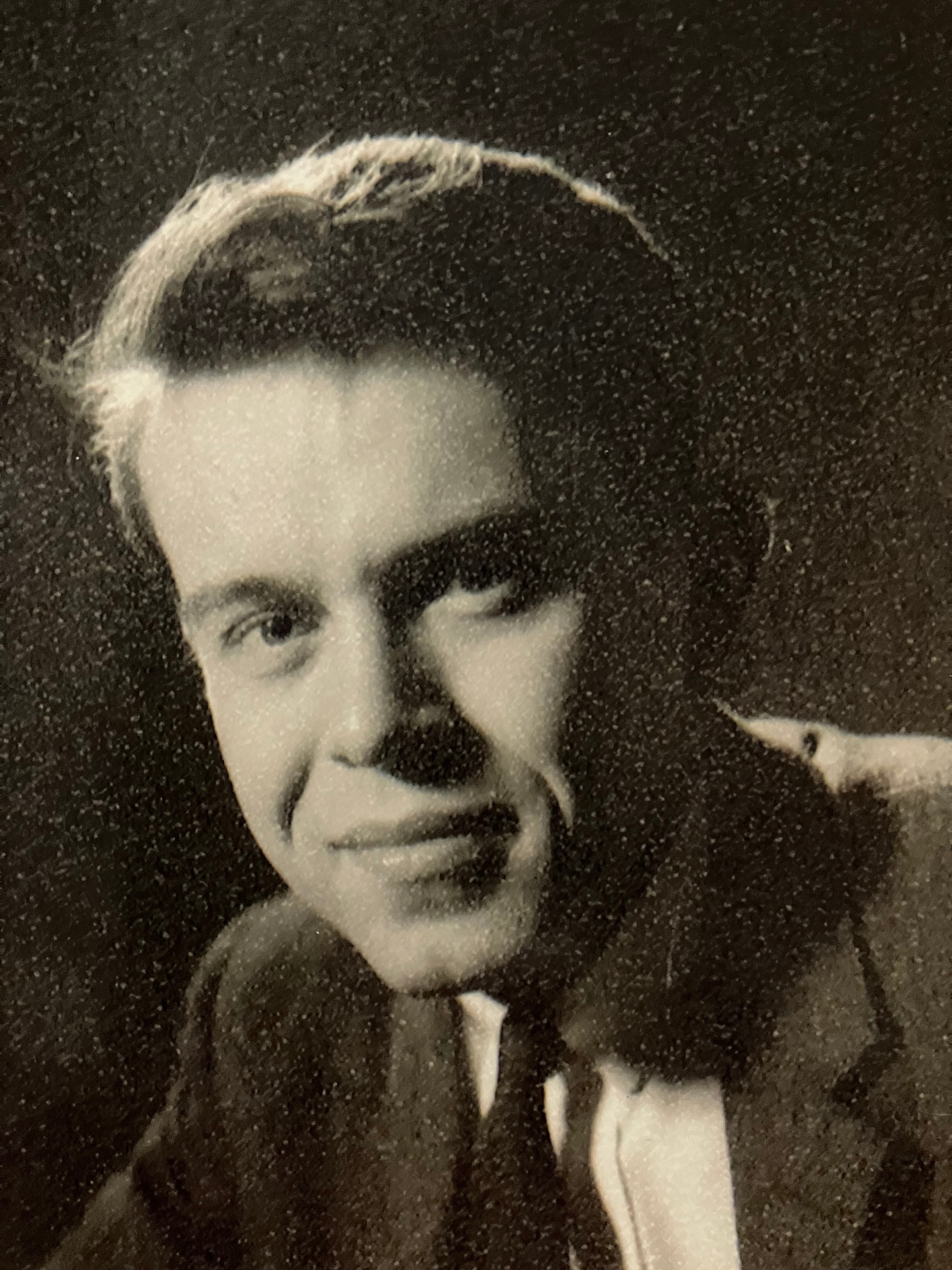 A black-and-white headshot of Paul