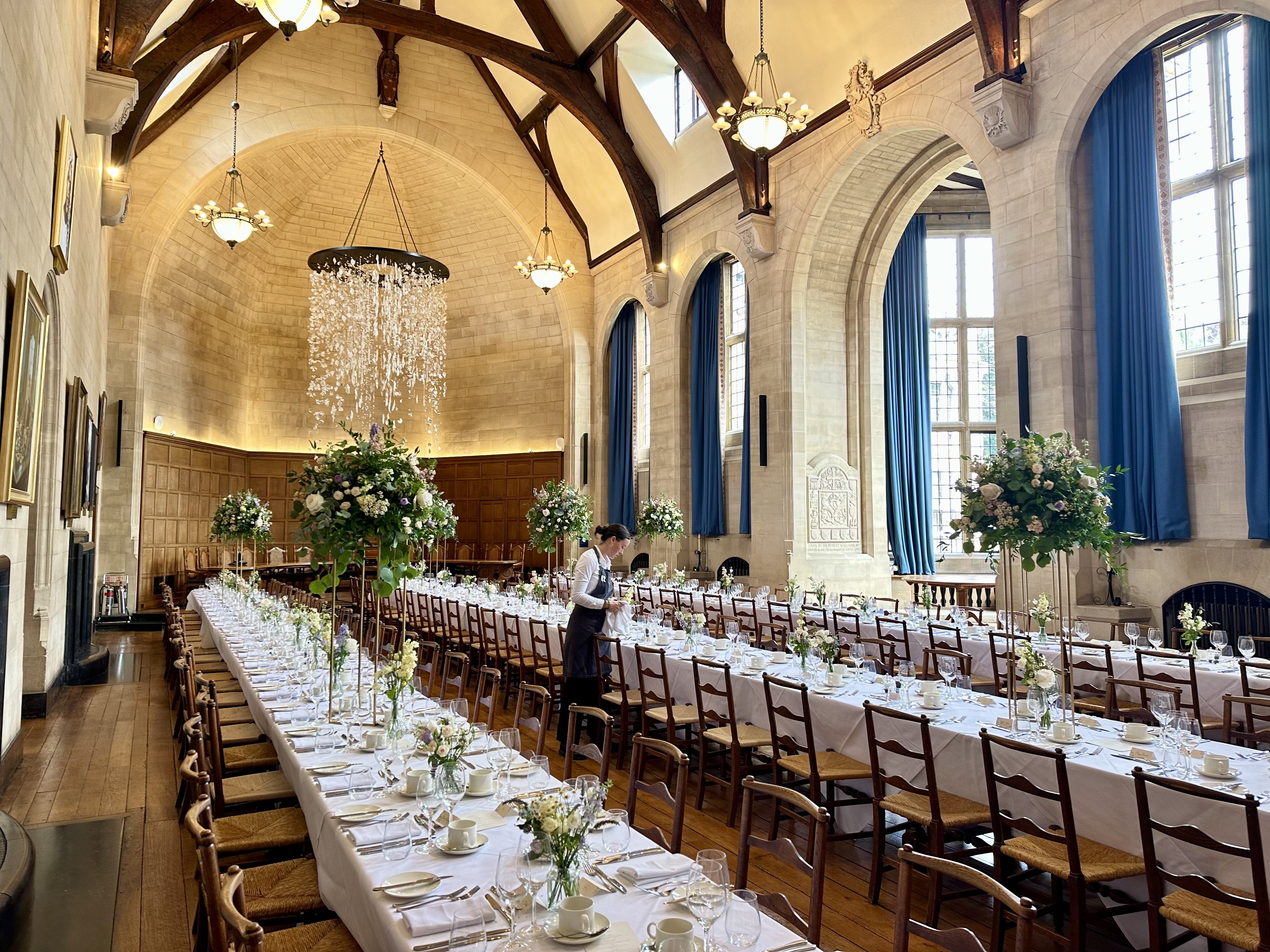 McCall MacBain Hall with banquet tables laid for a wedding meal and the top table in the background.