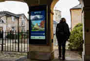 A scholar walking through an Oxford archway