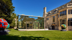 The Glass Pavilion at Rhodes House against a bright, blue sky.