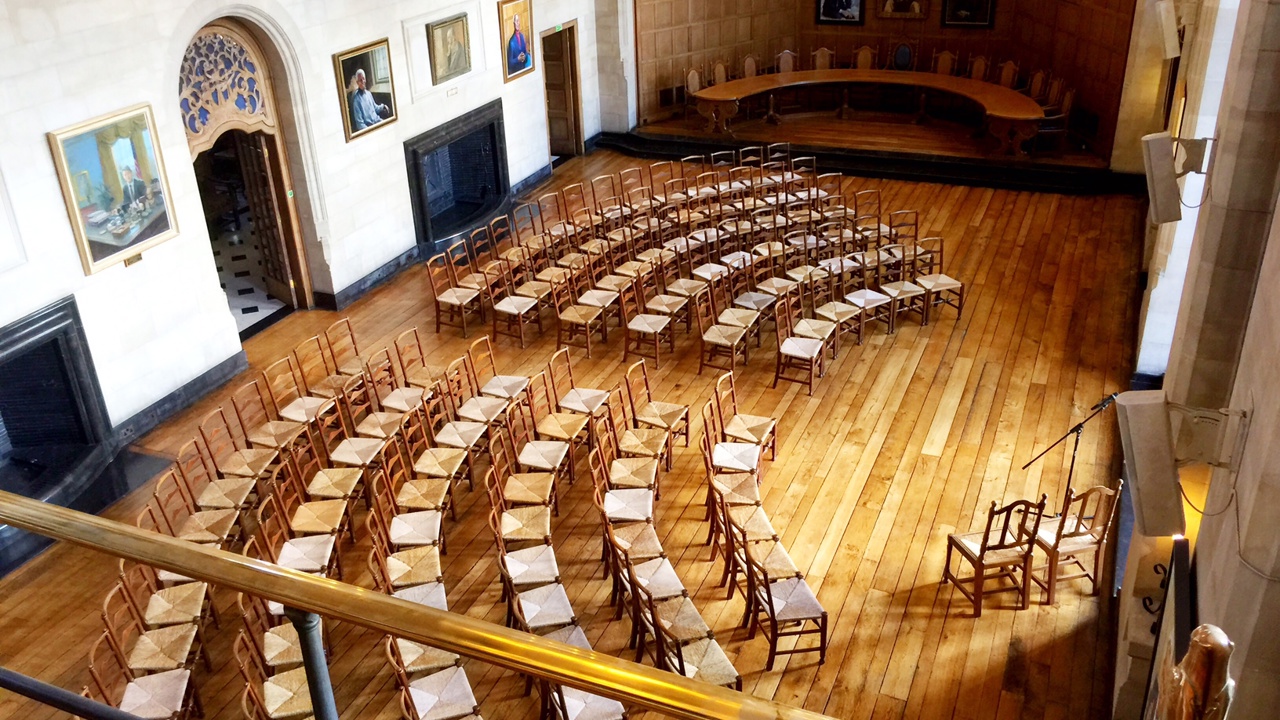 McCall MacBain Hall set up with 120 chairs in an arch layout facing the bay window.