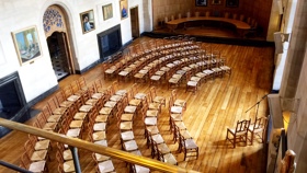 McCall MacBain Hall set up with 120 chairs in an arch layout facing the bay window.